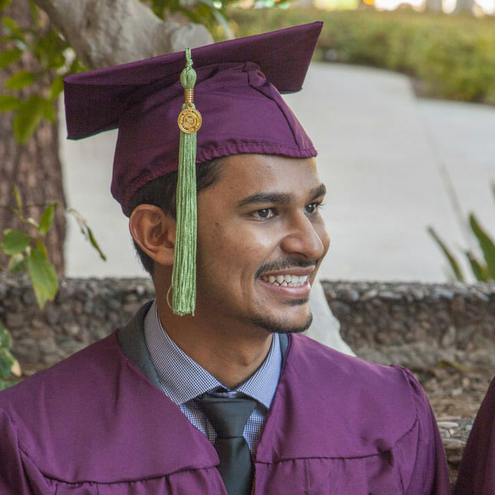Graduation headshot of Pratik Patel in cap and gown
