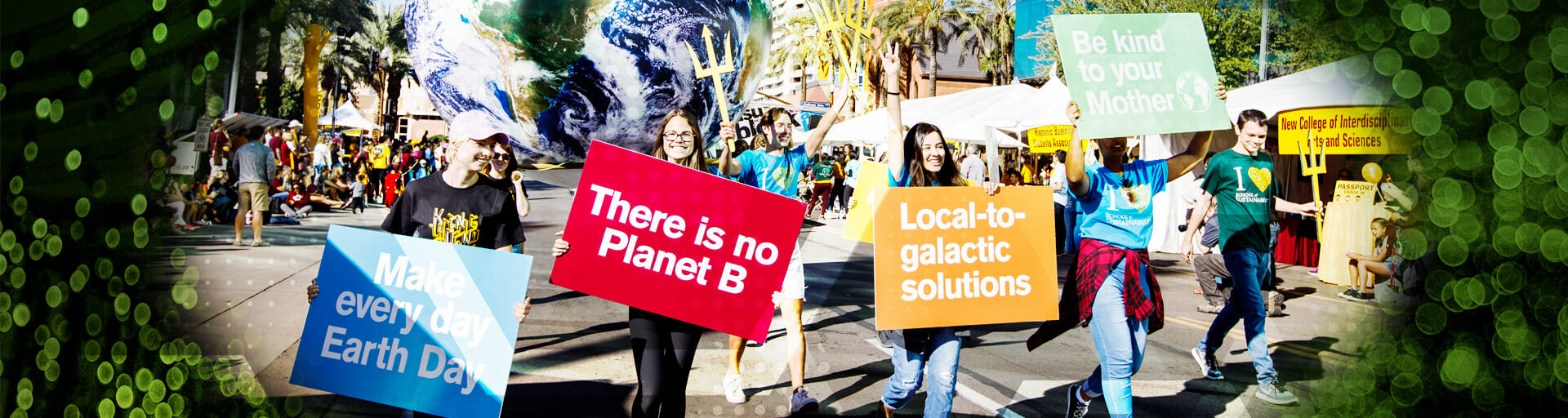 School of Sustainability students holding signs while marching in ASU Homecoming parade