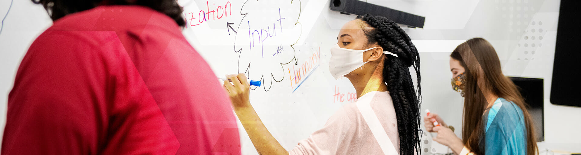 
		student wearing masks writing on blackboard		